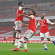 Pierre-Emerick Aubameyang of Arsenal celebrates with teammates Bukayo Saka and Alexandre Lacazette after scoring his team’s first goal during the Premier League match between Arsenal FC and Leicester City.